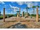 playground with swings and play structures at 4538 Grandview Glen Dr, Auburndale, FL 33823
