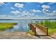 Lakefront community with a wooden dock at 4538 Grandview Glen Dr, Auburndale, FL 33823