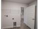 Laundry room with access to the kitchen and plenty of storage at 4544 Grand View Glen Dr, Auburndale, FL 33823