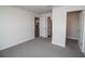 Bedroom with grey carpet, doors to a bathroom and closet at 4544 Grand View Glen Dr, Auburndale, FL 33823