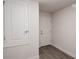 Bright laundry room with built-in shelving and a convenient door at 4544 Grand View Glen Dr, Auburndale, FL 33823