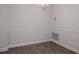 Elegant dining room with wainscoting and hardwood floors at 4544 Grand View Glen Dr, Auburndale, FL 33823
