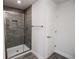 Bathroom with a large walk-in shower and grey tile at 4544 Grand View Glen Dr, Auburndale, FL 33823