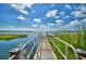 Serene lake access with a wooden walkway at 4544 Grand View Glen Dr, Auburndale, FL 33823