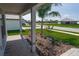 Covered front porch with view of neighborhood at 4544 Grand View Glen Dr, Auburndale, FL 33823