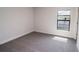 Bright bedroom with grey carpet and a window offering natural light at 4544 Grand View Glen Dr, Auburndale, FL 33823