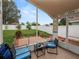 Relaxing screened porch with patio furniture and yard view at 244 Sweet Bay St, Davenport, FL 33837