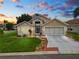 Two-story house with a two-car garage and a nicely landscaped yard at 244 Sweet Bay St, Davenport, FL 33837