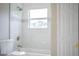 Updated bathroom with a bathtub and marble tile at 3926 Rollingsford Cir, Lakeland, FL 33810