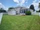 Spacious backyard with shed, patio, and grassy lawn at 323 Travelers Dr, Polk City, FL 33868