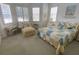 Bright bedroom with a comfortable bed and sitting area at 323 Travelers Dr, Polk City, FL 33868