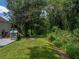 Large backyard with playset and mature trees at 6445 Forestwood W Dr, Lakeland, FL 33811