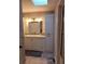 Bathroom with a vanity, skylight and linen cabinet at 1904 Sandford Rd, Lakeland, FL 33801