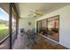 Relaxing screened porch with patio furniture, perfect for outdoor dining at 103 Coventry Ln, Haines City, FL 33844