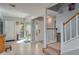 Bright foyer with tiled floors and staircase at 103 Coventry Ln, Haines City, FL 33844