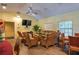 Community room with wicker furniture, TV, and dining area at 103 Coventry Ln, Haines City, FL 33844