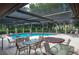 Relaxing pool area with patio furniture and spa at 103 Coventry Ln, Haines City, FL 33844