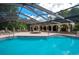 Resort-style pool with screened patio and spa at 103 Coventry Ln, Haines City, FL 33844