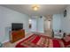 Comfortable bedroom with a double bed, dresser, and access to a bathroom at 103 Coventry Ln, Haines City, FL 33844