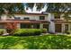 Well-maintained townhouse exterior with lush landscaping at 103 Coventry Ln, Haines City, FL 33844