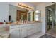 Primary bathroom with double vanity, shower, and plenty of storage at 103 Coventry Ln, Haines City, FL 33844