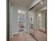 Large bathroom with a walk-in closet, double sinks, and a bathtub at 103 Coventry Ln, Haines City, FL 33844