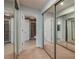 Large bathroom with mirrored closets and access to two bathrooms at 103 Coventry Ln, Haines City, FL 33844