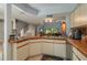Open kitchen with breakfast bar and views to living area at 103 Coventry Ln, Haines City, FL 33844