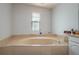 Relaxing bathroom with a large garden tub, perfect for soaking at 103 Coventry Ln, Haines City, FL 33844