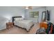 Bright bedroom with a double bed, nightstands, and a TV at 103 Coventry Ln, Haines City, FL 33844
