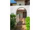 Inviting entryway with wrought iron gate leading to a private patio at 103 Coventry Ln, Haines City, FL 33844