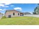 Large backyard with grassy area and privacy fence at 1955 Danes Ct, Lakeland, FL 33810