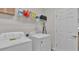 Bright laundry room, washer, dryer, and shelving for storage at 1955 Danes Ct, Lakeland, FL 33810