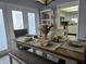 Dining area with a wooden table, bench seating, and access to a patio at 462 Cameo Dr # 462, Lakeland, FL 33803