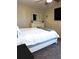 Bright bedroom with a queen-size bed and plenty of storage at 522 Raymond Ave, Frostproof, FL 33843