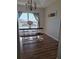 Spacious dining area with a large window and decorative wall art at 522 Raymond Ave, Frostproof, FL 33843