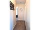 Bright hallway with neutral walls and carpeted floors at 522 Raymond Ave, Frostproof, FL 33843