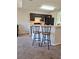 Kitchen with breakfast bar and dark brown cabinets at 522 Raymond Ave, Frostproof, FL 33843
