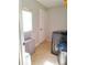 Laundry room with washer, dryer, storage and door to outside at 522 Raymond Ave, Frostproof, FL 33843