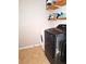 Laundry room with washer, dryer, and overhead shelving at 522 Raymond Ave, Frostproof, FL 33843