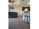 Living room with brown reclining sofa and kitchen bar at 522 Raymond Ave, Frostproof, FL 33843
