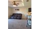 Living room with a brown reclining sofa and ceiling fan at 522 Raymond Ave, Frostproof, FL 33843