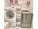 Laundry room with washer, dryer, and shelving for storage at 3258 Triple Crown Ln, Lakeland, FL 33811