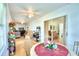 Sunroom features a table and chairs with views to the living area at 3258 Triple Crown Ln, Lakeland, FL 33811