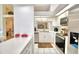 Well-equipped kitchen with white cabinets, stainless steel appliances, and ample counter space at 3258 Triple Crown Ln, Lakeland, FL 33811