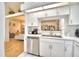 Modern kitchen featuring white cabinets, stainless steel appliances, and a built-in microwave at 3258 Triple Crown Ln, Lakeland, FL 33811