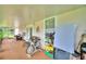 Enclosed patio with exercise bike and storage at 3258 Triple Crown Ln, Lakeland, FL 33811