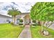 Single story house with a walkway and beautiful landscaping at 3258 Triple Crown Ln, Lakeland, FL 33811