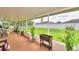 Relaxing screened patio with backyard view and plants at 3258 Triple Crown Ln, Lakeland, FL 33811