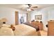 Relaxing bedroom with a queen bed and access to a sunroom at 3258 Triple Crown Ln, Lakeland, FL 33811